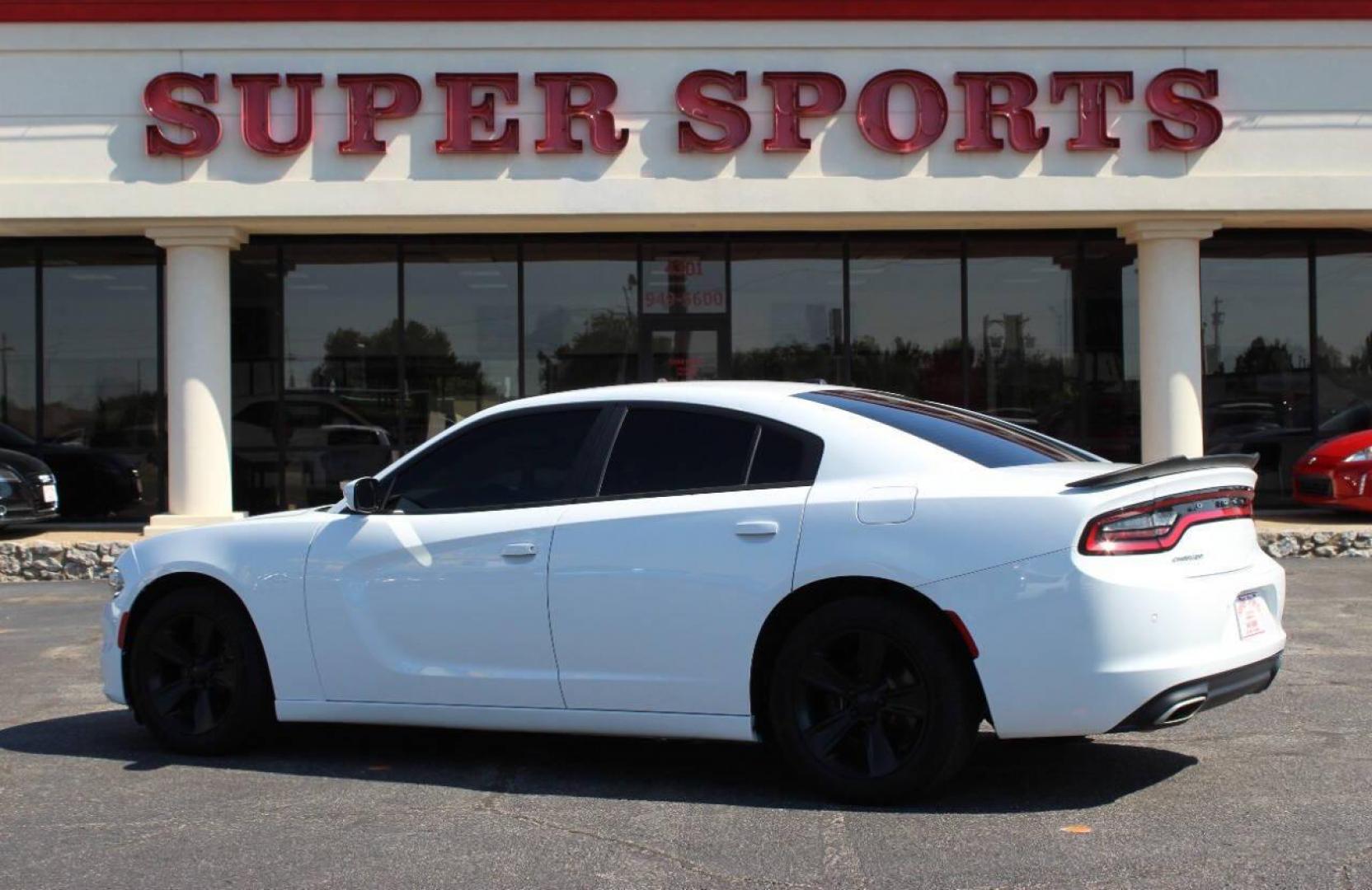 2015 White Dodge Charger SE (2C3CDXBG8FH) with an 3.6L V6 DOHC 24V engine, 8-Speed Automatic transmission, located at 4301 NW 39th , Oklahoma City, OK, 73112, (405) 949-5600, 35.512135, -97.598671 - Photo#5