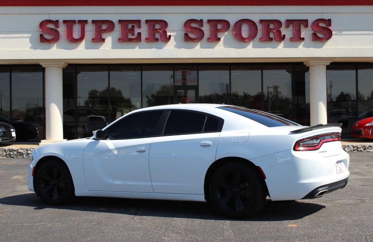 2015 White Dodge Charger SE (2C3CDXBG8FH) with an 3.6L V6 DOHC 24V engine, 8-Speed Automatic transmission, located at 4301 NW 39th , Oklahoma City, OK, 73112, (405) 949-5600, 35.512135, -97.598671 - NO DRIVERS LICENCE -NO FULL COVERAGE INSURANCE - NO CREDIT CHECK. COME ON OVER TO SUPERSPORTS, TAKE A LOOK AND TEST DRIVE. PLEASE GIVE US A CALL AT (405) 949-5600. NO LICENCIA DE CONDUCIR - NO SEGURO DE COBERTURA TOTAL - NO VERIFICACION DE CREDITO. VISITENOS EN SUPERSPORTS, MIRE NUESTRO - Photo#4