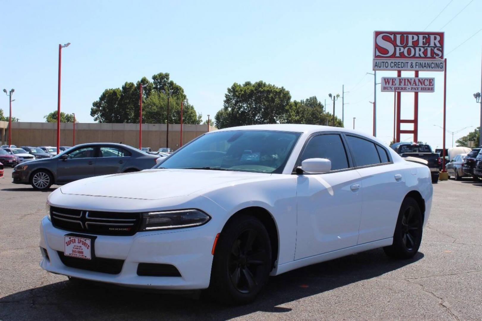 2015 White Dodge Charger SE (2C3CDXBG8FH) with an 3.6L V6 DOHC 24V engine, 8-Speed Automatic transmission, located at 4301 NW 39th , Oklahoma City, OK, 73112, (405) 949-5600, 35.512135, -97.598671 - Photo#7