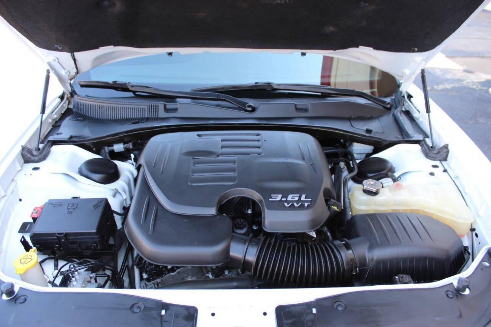 2015 White Dodge Charger SE (2C3CDXBG8FH) with an 3.6L V6 DOHC 24V engine, 8-Speed Automatic transmission, located at 4301 NW 39th , Oklahoma City, OK, 73112, (405) 949-5600, 35.512135, -97.598671 - Photo#8