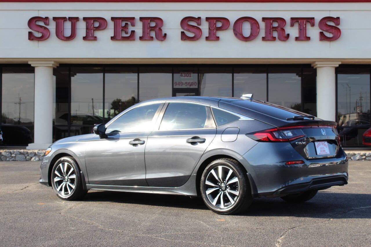 2024 Gray Honda Civic EX-L Hatchback (19XFL1H75RE) with an 1.5L I4 Turbocharger 1.5L I4 engine, CVT transmission, located at 4301 NW 39th , Oklahoma City, OK, 73112, (405) 949-5600, 35.512135, -97.598671 - NO DRIVERS LICENCE -NO FULL COVERAGE INSURANCE - NO CREDIT CHECK. COME ON OVER TO SUPERSPORTS, TAKE A LOOK AND TEST DRIVE. PLEASE GIVE US A CALL AT (405) 949-5600. NO LICENCIA DE CONDUCIR - NO SEGURO DE COBERTURA TOTAL - NO VERIFICACION DE CREDITO. VISITENOS EN SUPERSPORTS, MIRE NUESTRO - Photo#4