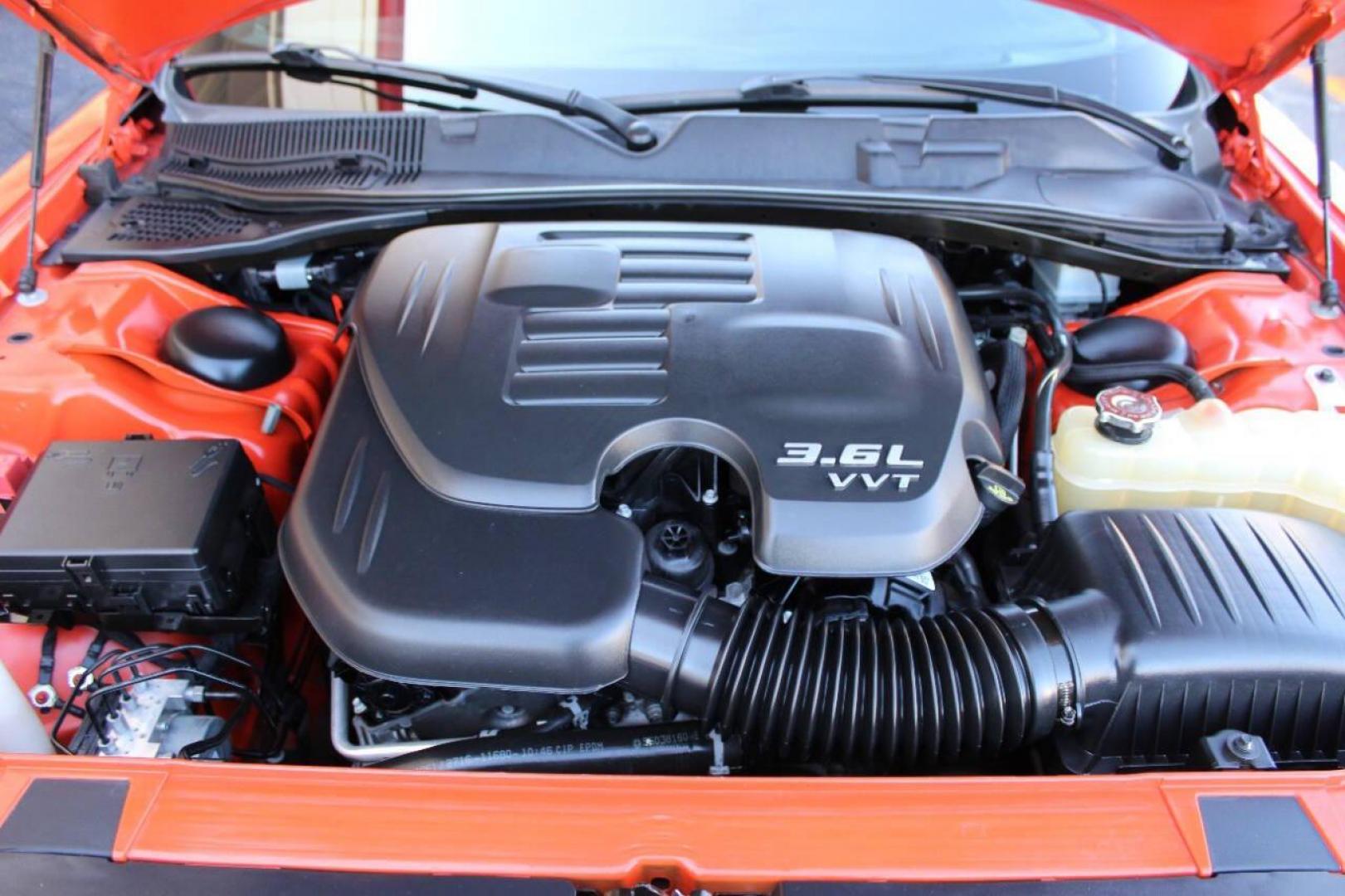 2016 Orange Dodge Challenger SXT (2C3CDZAG5GH) with an 3.6L V6 DOHC 24V engine, 5A transmission, located at 4301 NW 39th , Oklahoma City, OK, 73112, (405) 949-5600, 35.512135, -97.598671 - NO DRIVERS LICENCE -NO FULL COVERAGE INSURANCE - NO CREDIT CHECK. COME ON OVER TO SUPERSPORTS, TAKE A LOOK AND TEST DRIVE. PLEASE GIVE US A CALL AT (405) 949-5600. NO LICENCIA DE CONDUCIR - NO SEGURO DE COBERTURA TOTAL - NO VERIFICACION DE CREDITO. VISITENOS EN SUPERSPORTS, MIRE NUESTRO - Photo#7