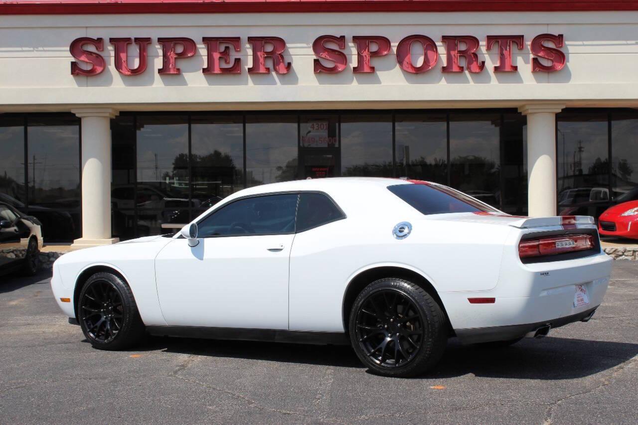 2014 White Dodge Challenger SXT (2C3CDYAG5EH) with an 3.6L V6 DOHC 24V engine, 5-Speed Automatic transmission, located at 4301 NW 39th , Oklahoma City, OK, 73112, (405) 949-5600, 35.512135, -97.598671 - NO DRIVERS LICENCE -NO FULL COVERAGE INSURANCE - NO CREDIT CHECK. COME ON OVER TO SUPERSPORTS, TAKE A LOOK AND TEST DRIVE. PLEASE GIVE US A CALL AT (405) 949-5600. NO LICENCIA DE CONDUCIR - NO SEGURO DE COBERTURA TOTAL - NO VERIFICACION DE CREDITO. VISITENOS EN SUPERSPORTS, MIRE NUESTRO - Photo#4