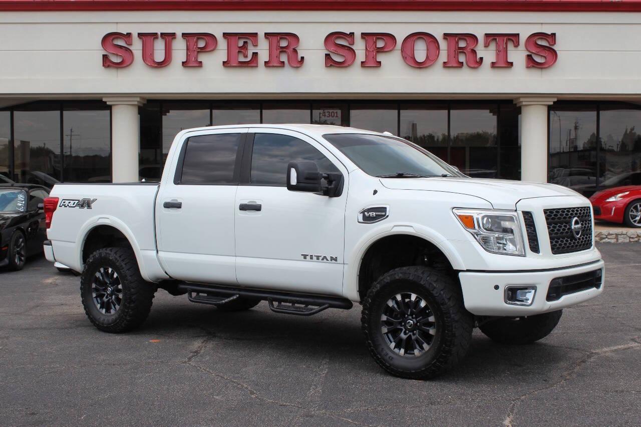 2017 White Nissan Titan Platinum Reserve Crew Cab 4WD (1N6AA1E58HN) with an 5.6L V8 DOHC 32V engine, 6A transmission, located at 4301 NW 39th , Oklahoma City, OK, 73112, (405) 949-5600, 35.512135, -97.598671 - NO DRIVERS LICENCE -NO FULL COVERAGE INSURANCE - NO CREDIT CHECK. COME ON OVER TO SUPERSPORTS, TAKE A LOOK AND TEST DRIVE. PLEASE GIVE US A CALL AT (405) 949-5600. NO LICENCIA DE CONDUCIR - NO SEGURO DE COBERTURA TOTAL - NO VERIFICACION DE CREDITO. VISITENOS EN SUPERSPORTS, MIRE NUESTRO - Photo#0