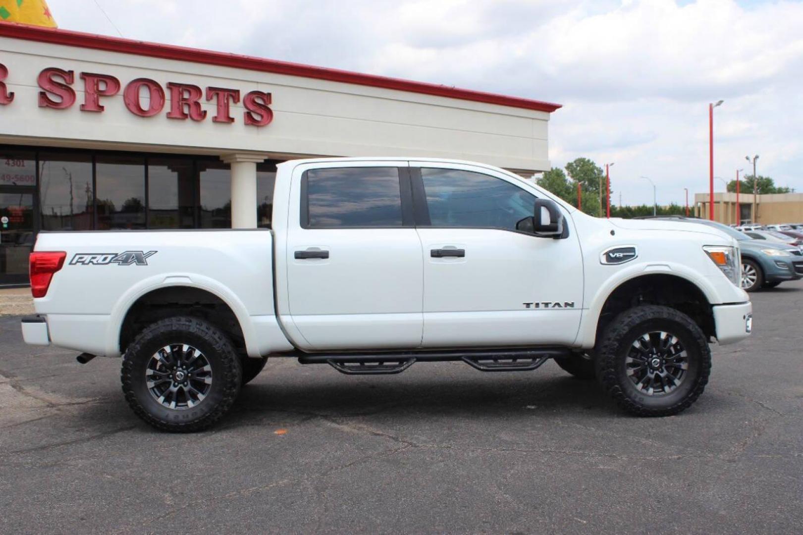 2017 White Nissan Titan Platinum Reserve Crew Cab 4WD (1N6AA1E58HN) with an 5.6L V8 DOHC 32V engine, 6A transmission, located at 4301 NW 39th , Oklahoma City, OK, 73112, (405) 949-5600, 35.512135, -97.598671 - Photo#2