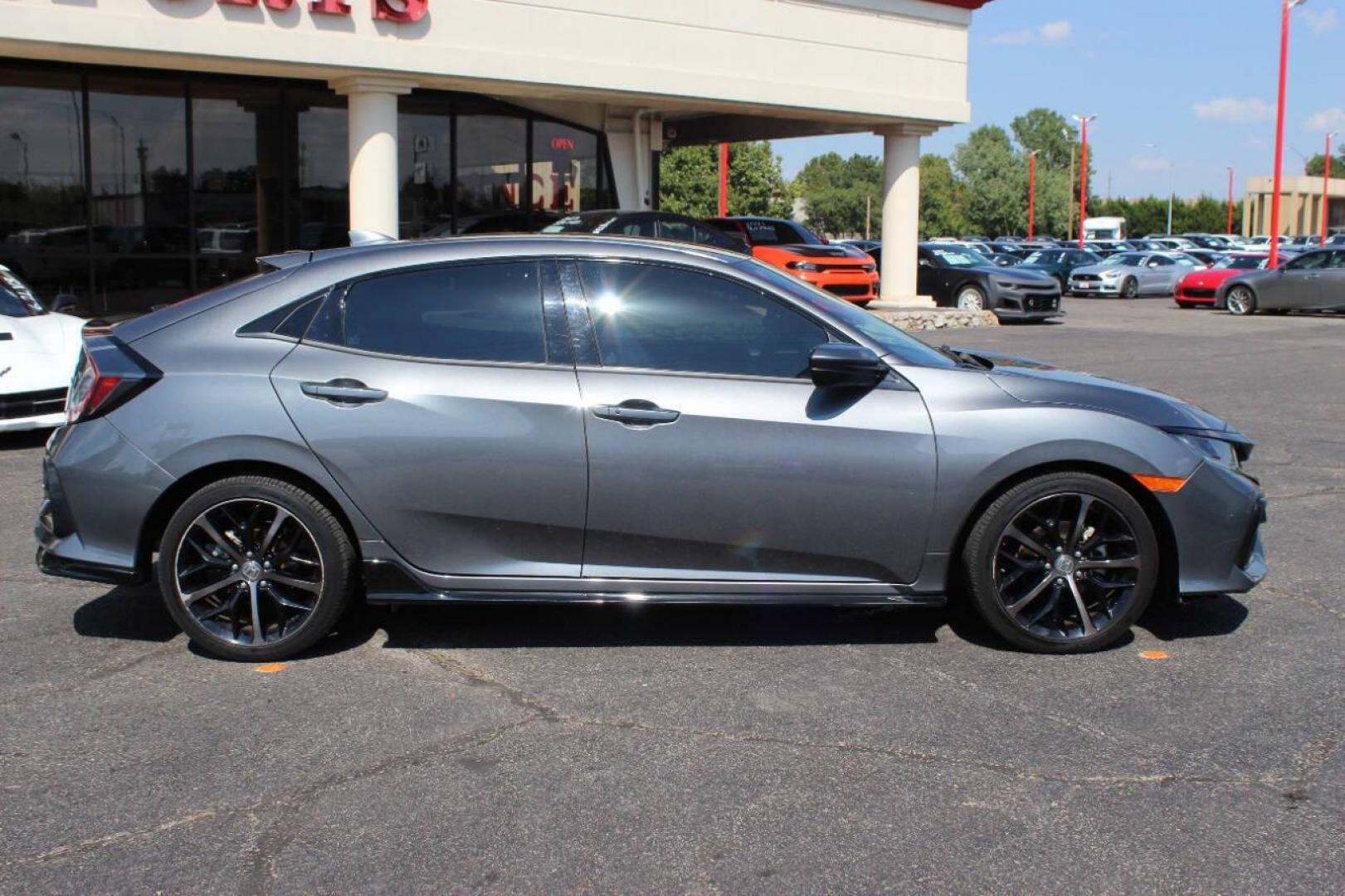 2021 Gray Honda Civic Sport Hatchback CVT (SHHFK7H41MU) with an 2.0L L4 DOHC 16V TURBO engine, CVT transmission, located at 4301 NW 39th , Oklahoma City, OK, 73112, (405) 949-5600, 35.512135, -97.598671 - NO DRIVERS LICENCE NO-FULL COVERAGE INSURANCE-NO CREDIT CHECK. COME ON OVER TO SUPERSPORTS AND TAKE A LOOK AND TEST DRIVE. PLEASE GIVE US A CALL AT (405) 949-5600. NO LICENSIA DE MANEJAR- NO SEGURO DE COBERTURA TOTAL- NO VERIFICACCION DE CREDITO. POR FAVOR VENGAN A SUPERSPORTS, ECHE UN - Photo#2