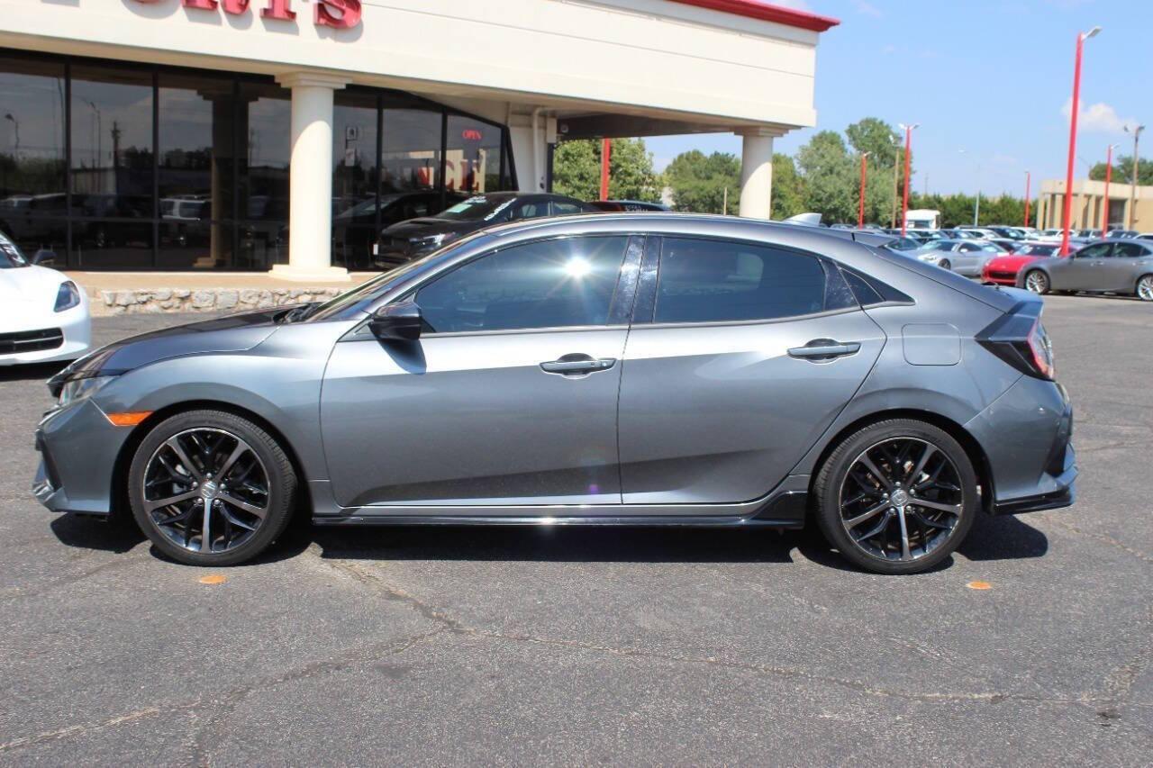 2021 Gray Honda Civic Sport Hatchback CVT (SHHFK7H41MU) with an 2.0L L4 DOHC 16V TURBO engine, CVT transmission, located at 4301 NW 39th , Oklahoma City, OK, 73112, (405) 949-5600, 35.512135, -97.598671 - NO DRIVERS LICENCE NO-FULL COVERAGE INSURANCE-NO CREDIT CHECK. COME ON OVER TO SUPERSPORTS AND TAKE A LOOK AND TEST DRIVE. PLEASE GIVE US A CALL AT (405) 949-5600. NO LICENSIA DE MANEJAR- NO SEGURO DE COBERTURA TOTAL- NO VERIFICACCION DE CREDITO. POR FAVOR VENGAN A SUPERSPORTS, ECHE UN - Photo#5
