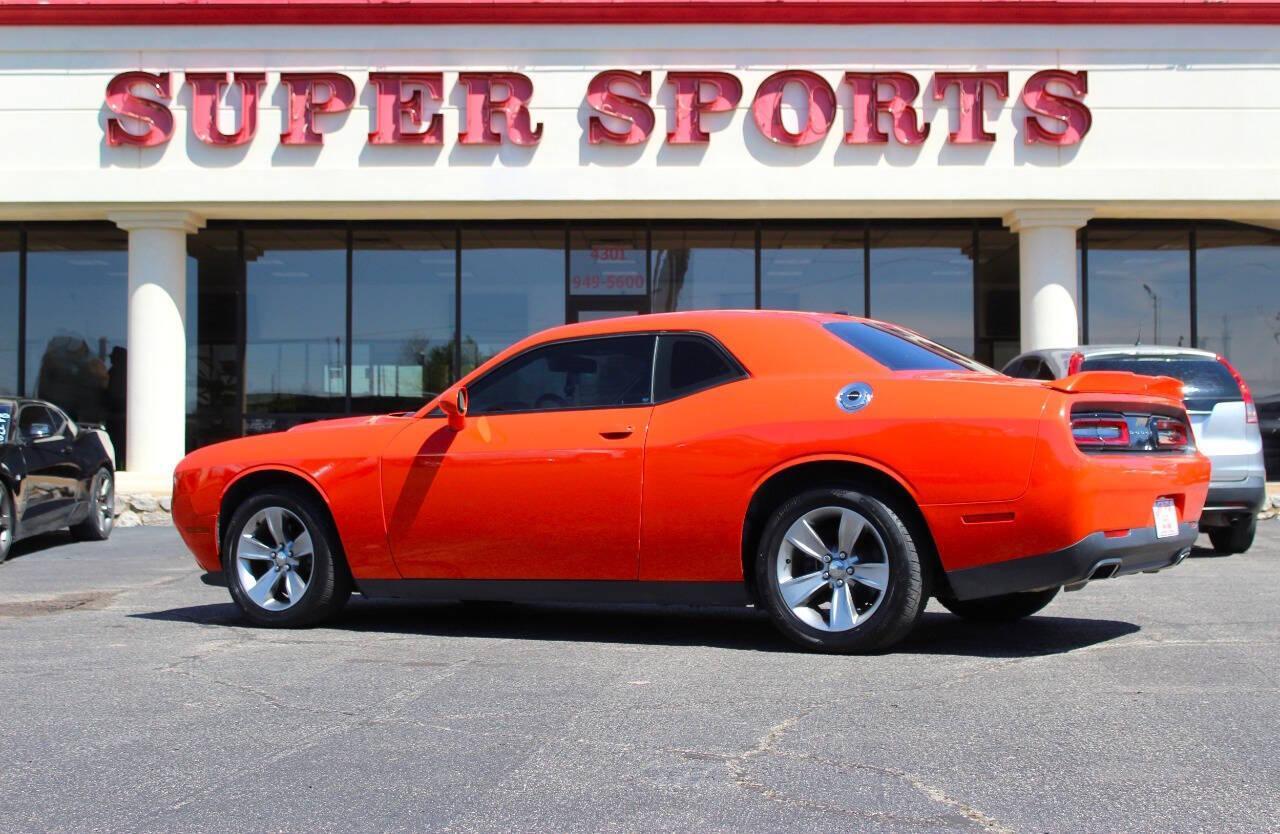 2019 Orange Dodge Challenger SXT (2C3CDZAG8KH) with an Pentastar 3.6L V6 305hp 268ft. lbs. 3.6L V6 engine, Automatic 8-Speed transmission, located at 4301 NW 39th , Oklahoma City, OK, 73112, (405) 949-5600, 35.512135, -97.598671 - NO DRIVERS LICENCE -NO FULL COVERAGE INSURANCE - NO CREDIT CHECK. COME ON OVER TO SUPERSPORTS, TAKE A LOOK AND TEST DRIVE. PLEASE GIVE US A CALL AT (405) 949-5600. NO LICENCIA DE CONDUCIR - NO SEGURO DE COBERTURA TOTAL - NO VERIFICACION DE CREDITO. VISITENOS EN SUPERSPORTS, MIRE NUESTRO - Photo#4
