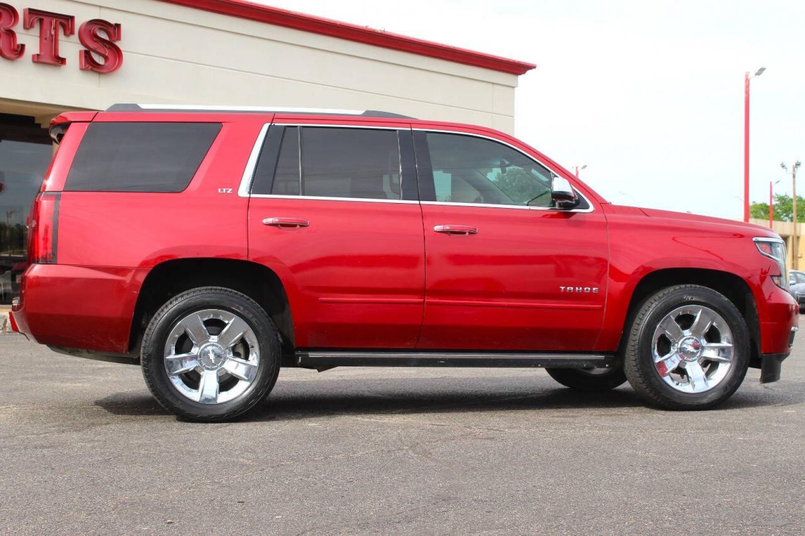 2015 Red Chevrolet Tahoe LTZ 4WD (1GNSKCKC8FR) with an EcoTec3 5.3L Flex Fuel V8 355hp 383ft. lbs. 5.3L V8 engine, Automatic 6-Speed transmission, located at 4301 NW 39th , Oklahoma City, OK, 73112, (405) 949-5600, 35.512135, -97.598671- Photo#2