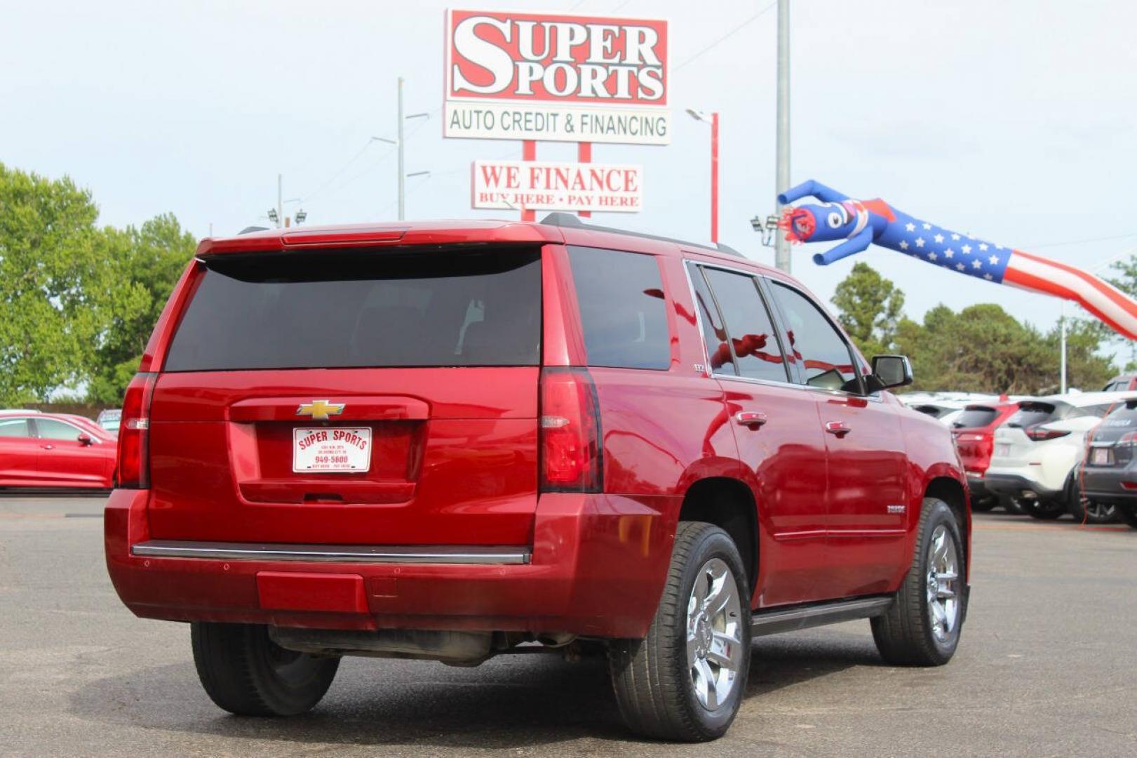 2015 Red Chevrolet Tahoe LTZ 4WD (1GNSKCKC8FR) with an EcoTec3 5.3L Flex Fuel V8 355hp 383ft. lbs. 5.3L V8 engine, Automatic 6-Speed transmission, located at 4301 NW 39th , Oklahoma City, OK, 73112, (405) 949-5600, 35.512135, -97.598671- Photo#3