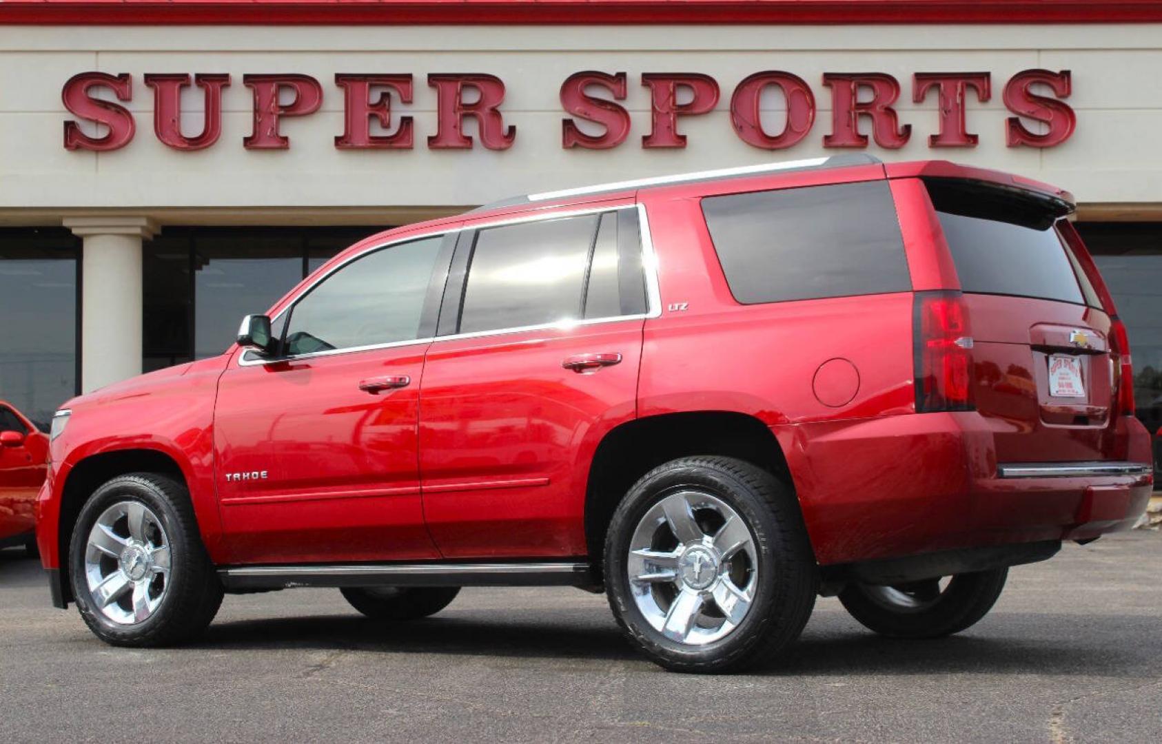 2015 Red Chevrolet Tahoe LTZ 4WD (1GNSKCKC8FR) with an EcoTec3 5.3L Flex Fuel V8 355hp 383ft. lbs. 5.3L V8 engine, Automatic 6-Speed transmission, located at 4301 NW 39th , Oklahoma City, OK, 73112, (405) 949-5600, 35.512135, -97.598671- Photo#4