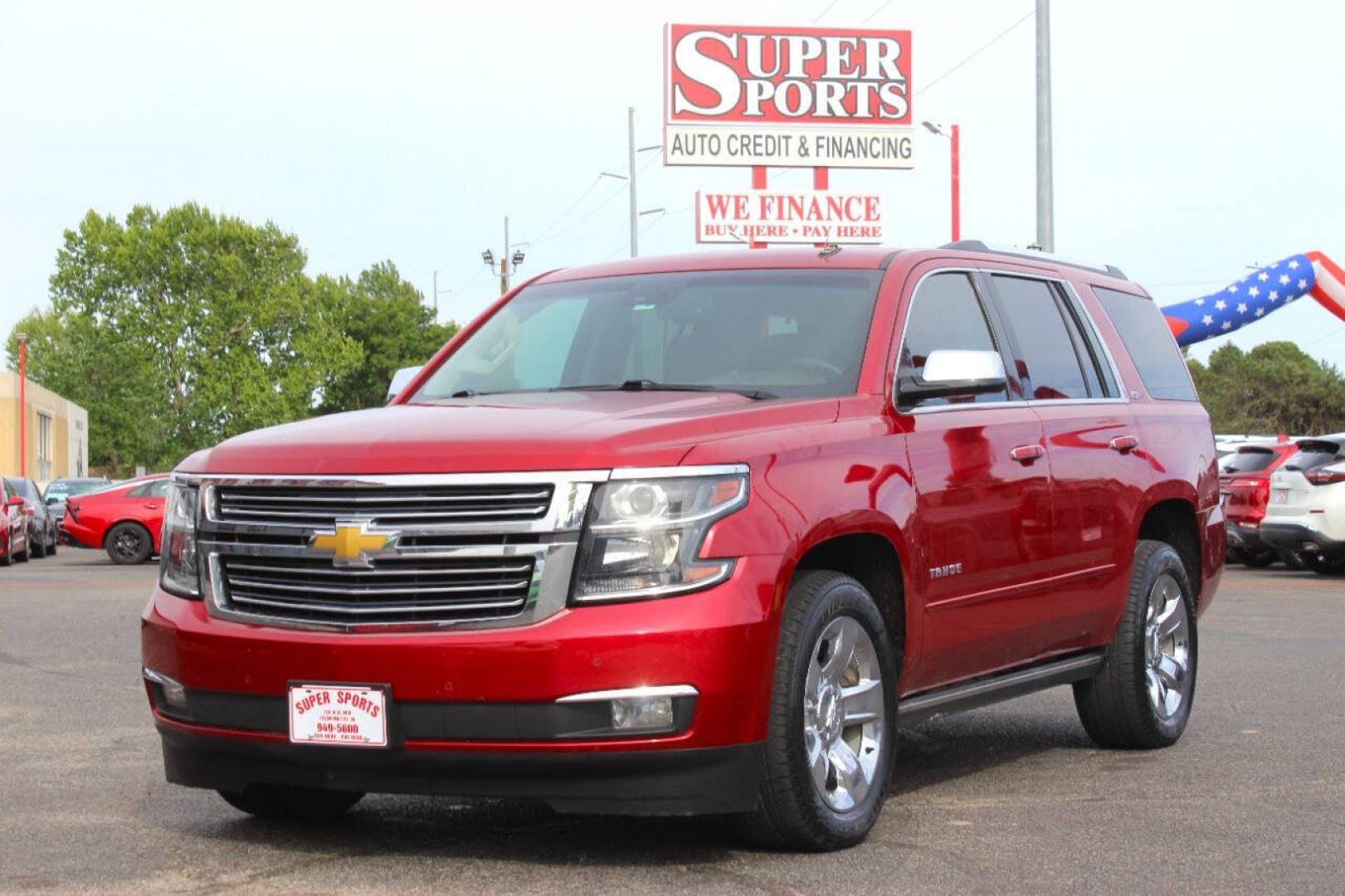 2015 Red Chevrolet Tahoe LTZ 4WD (1GNSKCKC8FR) with an EcoTec3 5.3L Flex Fuel V8 355hp 383ft. lbs. 5.3L V8 engine, Automatic 6-Speed transmission, located at 4301 NW 39th , Oklahoma City, OK, 73112, (405) 949-5600, 35.512135, -97.598671- Photo#6