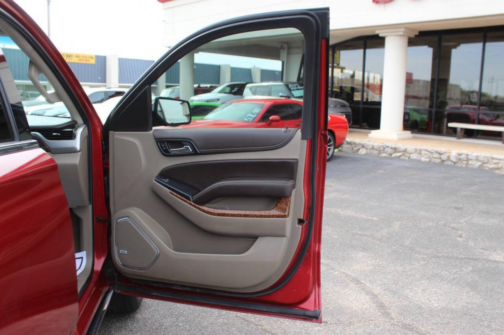 2015 Red Chevrolet Tahoe LTZ 4WD (1GNSKCKC8FR) with an EcoTec3 5.3L Flex Fuel V8 355hp 383ft. lbs. 5.3L V8 engine, Automatic 6-Speed transmission, located at 4301 NW 39th , Oklahoma City, OK, 73112, (405) 949-5600, 35.512135, -97.598671- Photo#9