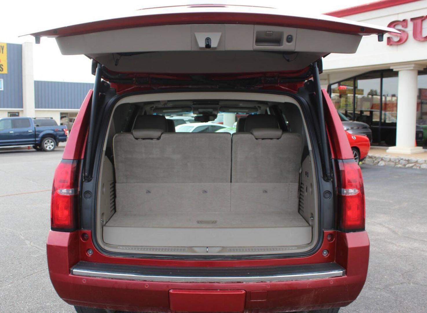 2015 Red Chevrolet Tahoe LTZ 4WD (1GNSKCKC8FR) with an EcoTec3 5.3L Flex Fuel V8 355hp 383ft. lbs. 5.3L V8 engine, Automatic 6-Speed transmission, located at 4301 NW 39th , Oklahoma City, OK, 73112, (405) 949-5600, 35.512135, -97.598671- Photo#13