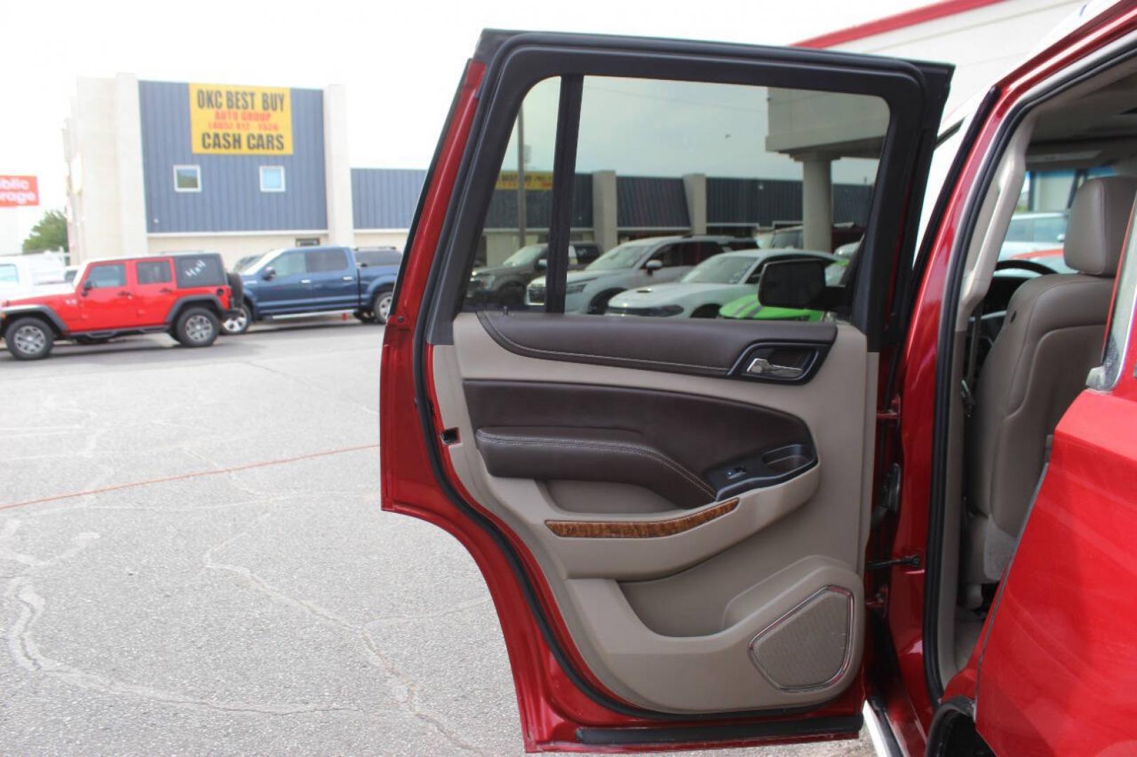2015 Red Chevrolet Tahoe LTZ 4WD (1GNSKCKC8FR) with an EcoTec3 5.3L Flex Fuel V8 355hp 383ft. lbs. 5.3L V8 engine, Automatic 6-Speed transmission, located at 4301 NW 39th , Oklahoma City, OK, 73112, (405) 949-5600, 35.512135, -97.598671- Photo#19