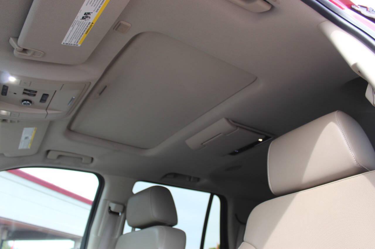 2015 Red Chevrolet Tahoe LTZ 4WD (1GNSKCKC8FR) with an EcoTec3 5.3L Flex Fuel V8 355hp 383ft. lbs. 5.3L V8 engine, Automatic 6-Speed transmission, located at 4301 NW 39th , Oklahoma City, OK, 73112, (405) 949-5600, 35.512135, -97.598671 - NO DRIVERS LICENCE -NO FULL COVERAGE INSURANCE - NO CREDIT CHECK. COME ON OVER TO SUPERSPORTS, TAKE A LOOK AND TEST DRIVE. PLEASE GIVE US A CALL AT (405) 949-5600. NO LICENCIA DE CONDUCIR - NO SEGURO DE COBERTURA TOTAL - NO VERIFICACION DE CREDITO. VISITENOS EN SUPERSPORTS, MIRE NUEST - Photo#25