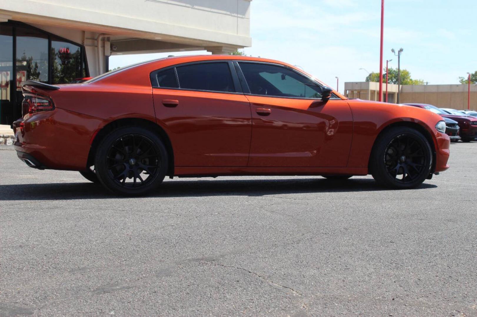 2021 Orange Dodge Charger SXT (2C3CDXBG6MH) with an Pentastar 3.6L V6 292hp 260ft. lbs. 3.6L V6 engine, Automatic 8-Speed transmission, located at 4301 NW 39th , Oklahoma City, OK, 73112, (405) 949-5600, 35.512135, -97.598671 - Hablamos espanol. SPEND SMART --- BUY FROM SUPER SPORTS. ALL PRICES, DOWN PAYMENTS, PAYMENTS, AND FINANCE TERMS ARE NEGOTIABLE AT THE TIME OF APPROVAL. WE WILL WORK WITH YOU TO FIT YOUR BUDGET. WE WILL EVEN LOWER AND ADJUST THE NUMBERS TO HELP MAKE THE VEHICLE MORE AFFORDABLE FOR YOU.- Photo#2