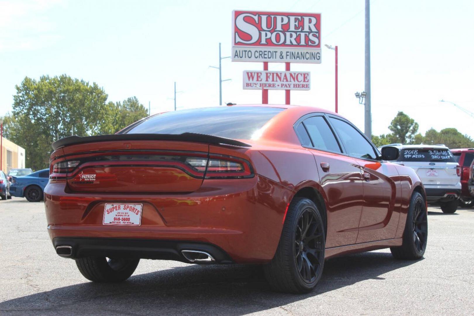 2021 Orange Dodge Charger SXT (2C3CDXBG6MH) with an Pentastar 3.6L V6 292hp 260ft. lbs. 3.6L V6 engine, Automatic 8-Speed transmission, located at 4301 NW 39th , Oklahoma City, OK, 73112, (405) 949-5600, 35.512135, -97.598671 - Hablamos espanol. SPEND SMART --- BUY FROM SUPER SPORTS. ALL PRICES, DOWN PAYMENTS, PAYMENTS, AND FINANCE TERMS ARE NEGOTIABLE AT THE TIME OF APPROVAL. WE WILL WORK WITH YOU TO FIT YOUR BUDGET. WE WILL EVEN LOWER AND ADJUST THE NUMBERS TO HELP MAKE THE VEHICLE MORE AFFORDABLE FOR YOU.- Photo#3