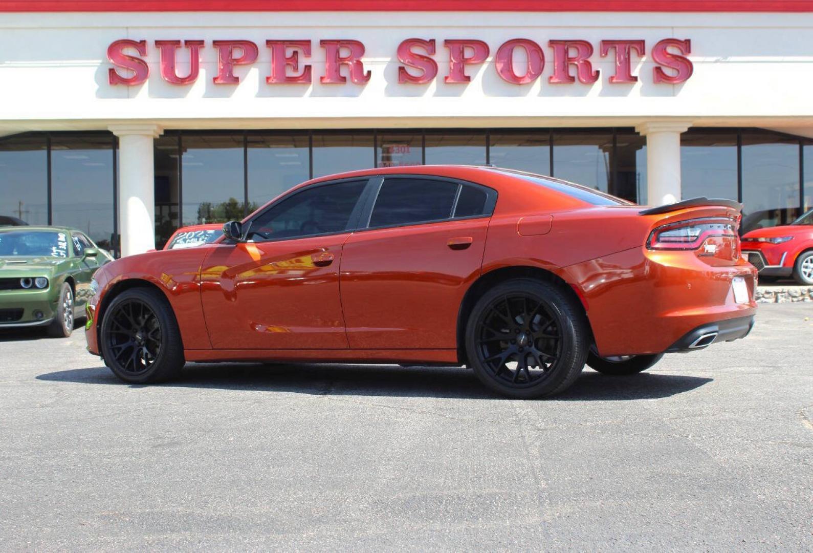 2021 Orange Dodge Charger SXT (2C3CDXBG6MH) with an Pentastar 3.6L V6 292hp 260ft. lbs. 3.6L V6 engine, Automatic 8-Speed transmission, located at 4301 NW 39th , Oklahoma City, OK, 73112, (405) 949-5600, 35.512135, -97.598671 - Hablamos espanol. SPEND SMART --- BUY FROM SUPER SPORTS. ALL PRICES, DOWN PAYMENTS, PAYMENTS, AND FINANCE TERMS ARE NEGOTIABLE AT THE TIME OF APPROVAL. WE WILL WORK WITH YOU TO FIT YOUR BUDGET. WE WILL EVEN LOWER AND ADJUST THE NUMBERS TO HELP MAKE THE VEHICLE MORE AFFORDABLE FOR YOU.- Photo#4