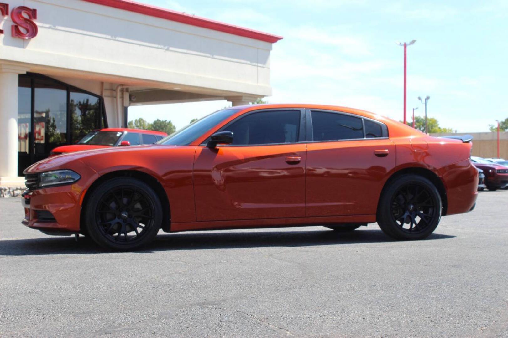 2021 Orange Dodge Charger SXT (2C3CDXBG6MH) with an Pentastar 3.6L V6 292hp 260ft. lbs. 3.6L V6 engine, Automatic 8-Speed transmission, located at 4301 NW 39th , Oklahoma City, OK, 73112, (405) 949-5600, 35.512135, -97.598671 - Hablamos espanol. SPEND SMART --- BUY FROM SUPER SPORTS. ALL PRICES, DOWN PAYMENTS, PAYMENTS, AND FINANCE TERMS ARE NEGOTIABLE AT THE TIME OF APPROVAL. WE WILL WORK WITH YOU TO FIT YOUR BUDGET. WE WILL EVEN LOWER AND ADJUST THE NUMBERS TO HELP MAKE THE VEHICLE MORE AFFORDABLE FOR YOU.- Photo#5