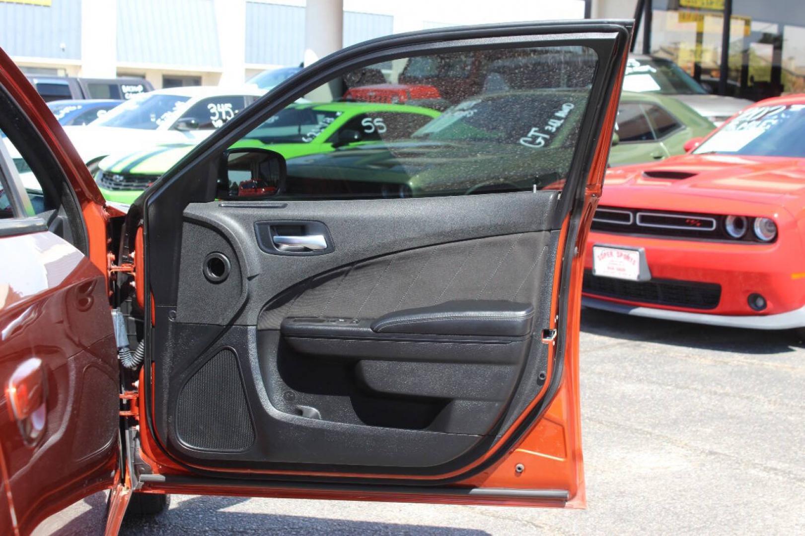 2021 Orange Dodge Charger SXT (2C3CDXBG6MH) with an Pentastar 3.6L V6 292hp 260ft. lbs. 3.6L V6 engine, Automatic 8-Speed transmission, located at 4301 NW 39th , Oklahoma City, OK, 73112, (405) 949-5600, 35.512135, -97.598671 - Hablamos espanol. SPEND SMART --- BUY FROM SUPER SPORTS. ALL PRICES, DOWN PAYMENTS, PAYMENTS, AND FINANCE TERMS ARE NEGOTIABLE AT THE TIME OF APPROVAL. WE WILL WORK WITH YOU TO FIT YOUR BUDGET. WE WILL EVEN LOWER AND ADJUST THE NUMBERS TO HELP MAKE THE VEHICLE MORE AFFORDABLE FOR YOU.- Photo#9