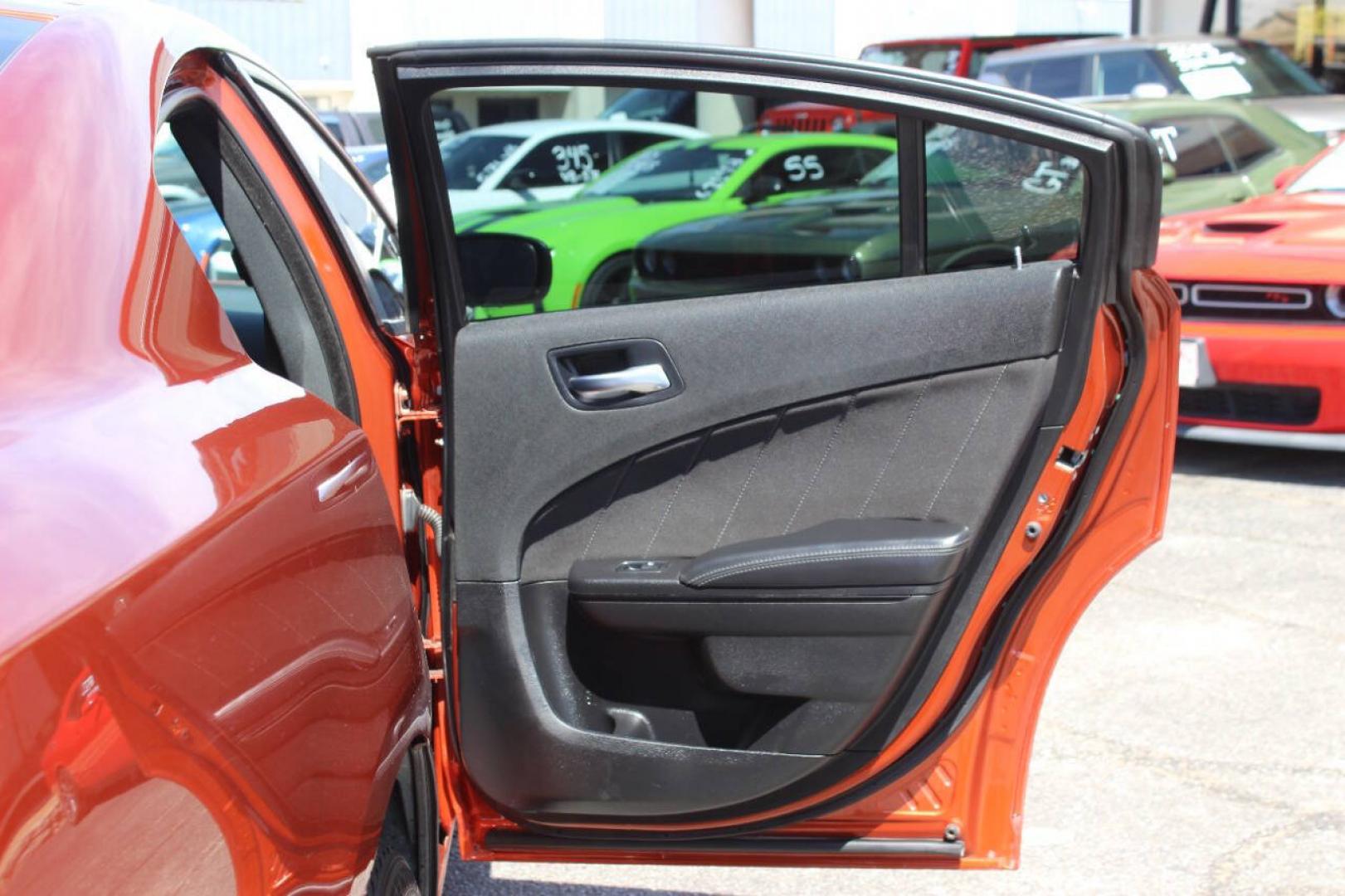 2021 Orange Dodge Charger SXT (2C3CDXBG6MH) with an Pentastar 3.6L V6 292hp 260ft. lbs. 3.6L V6 engine, Automatic 8-Speed transmission, located at 4301 NW 39th , Oklahoma City, OK, 73112, (405) 949-5600, 35.512135, -97.598671 - Hablamos espanol. SPEND SMART --- BUY FROM SUPER SPORTS. ALL PRICES, DOWN PAYMENTS, PAYMENTS, AND FINANCE TERMS ARE NEGOTIABLE AT THE TIME OF APPROVAL. WE WILL WORK WITH YOU TO FIT YOUR BUDGET. WE WILL EVEN LOWER AND ADJUST THE NUMBERS TO HELP MAKE THE VEHICLE MORE AFFORDABLE FOR YOU.- Photo#11