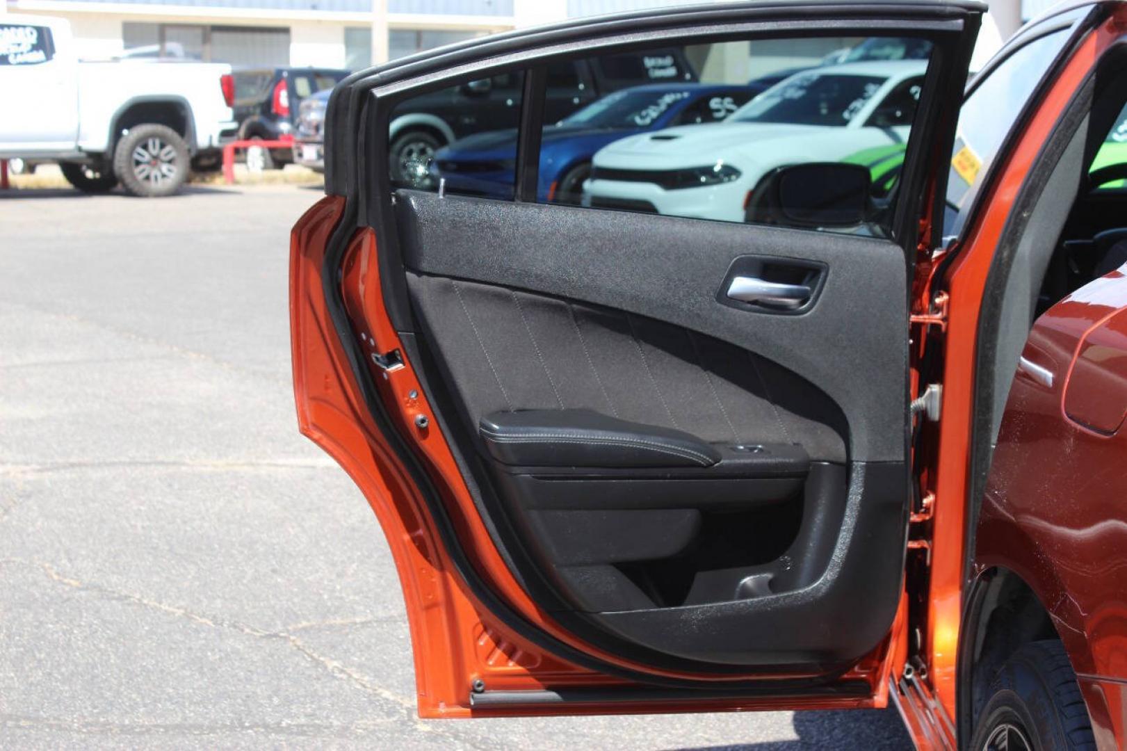 2021 Orange Dodge Charger SXT (2C3CDXBG6MH) with an Pentastar 3.6L V6 292hp 260ft. lbs. 3.6L V6 engine, Automatic 8-Speed transmission, located at 4301 NW 39th , Oklahoma City, OK, 73112, (405) 949-5600, 35.512135, -97.598671 - Hablamos espanol. SPEND SMART --- BUY FROM SUPER SPORTS. ALL PRICES, DOWN PAYMENTS, PAYMENTS, AND FINANCE TERMS ARE NEGOTIABLE AT THE TIME OF APPROVAL. WE WILL WORK WITH YOU TO FIT YOUR BUDGET. WE WILL EVEN LOWER AND ADJUST THE NUMBERS TO HELP MAKE THE VEHICLE MORE AFFORDABLE FOR YOU.- Photo#15