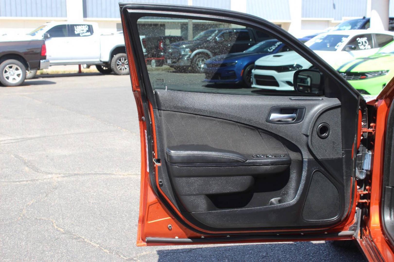 2021 Orange Dodge Charger SXT (2C3CDXBG6MH) with an Pentastar 3.6L V6 292hp 260ft. lbs. 3.6L V6 engine, Automatic 8-Speed transmission, located at 4301 NW 39th , Oklahoma City, OK, 73112, (405) 949-5600, 35.512135, -97.598671 - Hablamos espanol. SPEND SMART --- BUY FROM SUPER SPORTS. ALL PRICES, DOWN PAYMENTS, PAYMENTS, AND FINANCE TERMS ARE NEGOTIABLE AT THE TIME OF APPROVAL. WE WILL WORK WITH YOU TO FIT YOUR BUDGET. WE WILL EVEN LOWER AND ADJUST THE NUMBERS TO HELP MAKE THE VEHICLE MORE AFFORDABLE FOR YOU.- Photo#18