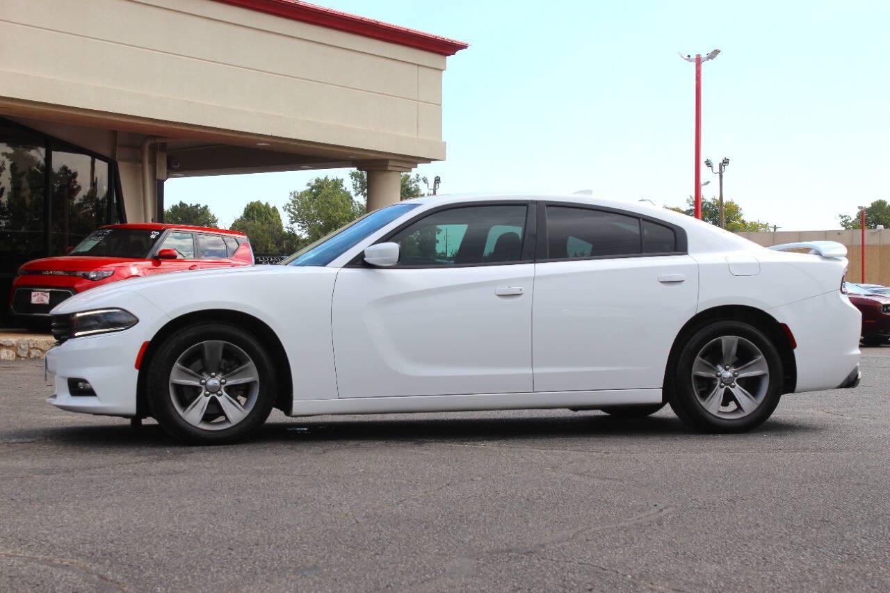 2016 White Dodge Charger SXT (2C3CDXHG4GH) with an Pentastar 3.6L V6 292hp 260ft. lbs. 3.6L V6 engine, Automatic 8-Speed transmission, located at 4301 NW 39th , Oklahoma City, OK, 73112, (405) 949-5600, 35.512135, -97.598671 - Hablamos espanol. SPEND SMART --- BUY FROM SUPER SPORTS. ALL PRICES, DOWN PAYMENTS, PAYMENTS, AND FINANCE TERMS ARE NEGOTIABLE AT THE TIME OF APPROVAL. WE WILL WORK WITH YOU TO FIT YOUR BUDGET. WE WILL EVEN LOWER AND ADJUST THE NUMBERS TO HELP MAKE THE VE HICLE MORE AFFORDABLE FOR YOU.- Photo#5
