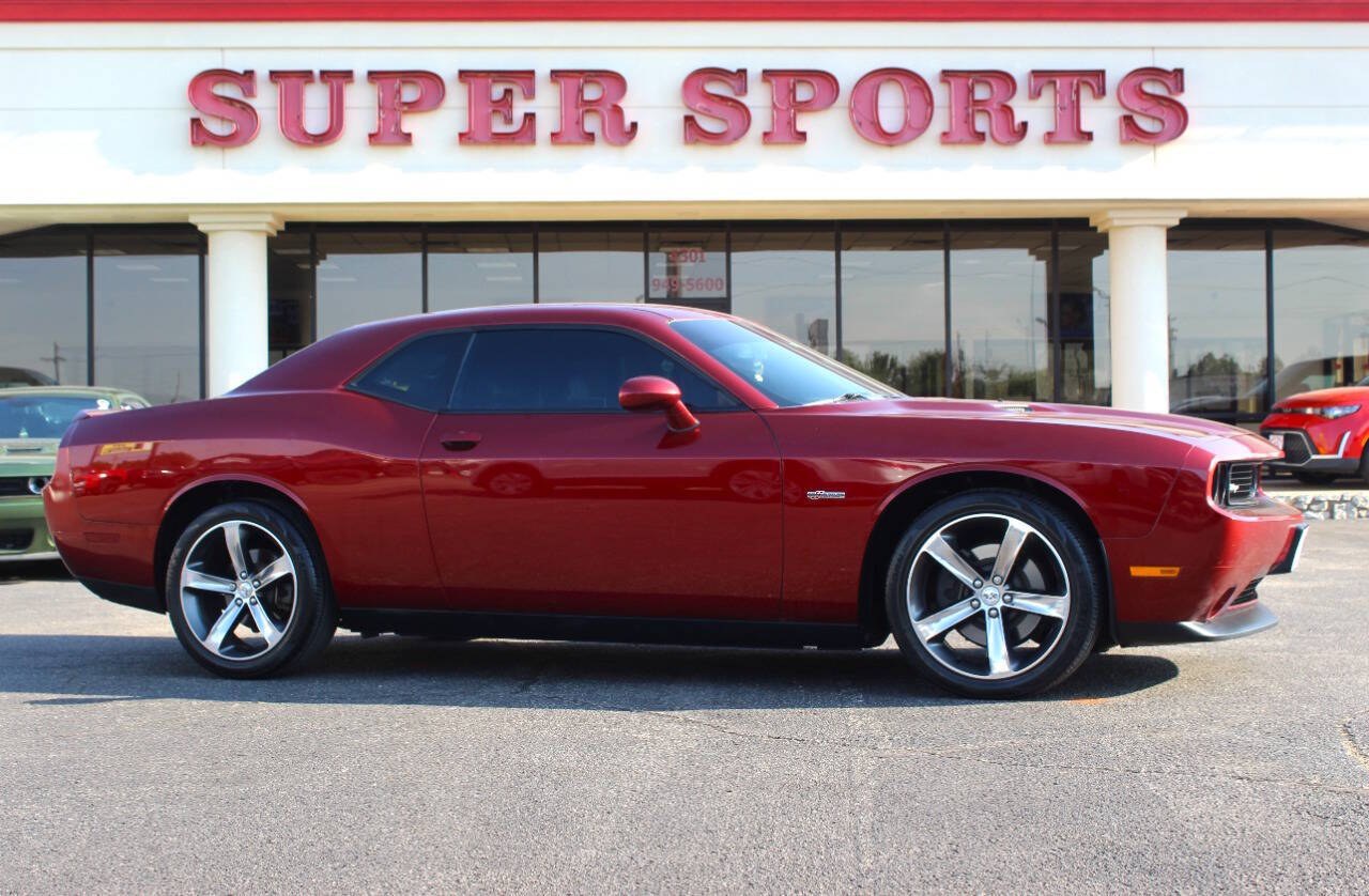 2014 Burgundy Dodge Challenger SXT (2C3CDYAG0EH) with an Pentastar 3.6L V6 305hp 268ft. lbs. 3.6L V6 engine, Automatic 5-Speed transmission, located at 4301 NW 39th , Oklahoma City, OK, 73112, (405) 949-5600, 35.512135, -97.598671 - Hablamos espanol. SPEND SMART --- BUY FROM SUPER SPORTS. ALL PRICES, DOWN PAYMENTS, PAYMENTS, AND FINANCE TERMS ARE NEGOTIABLE AT THE TIME OF APPROVAL. WE WILL WORK WITH YOU TO FIT YOUR BUDGET. WE WILL EVEN LOWER AND ADJUST THE NUMBERS TO HELP MAKE THE VEHICLE MORE AFFORDABLE FOR YOU.- Photo#0