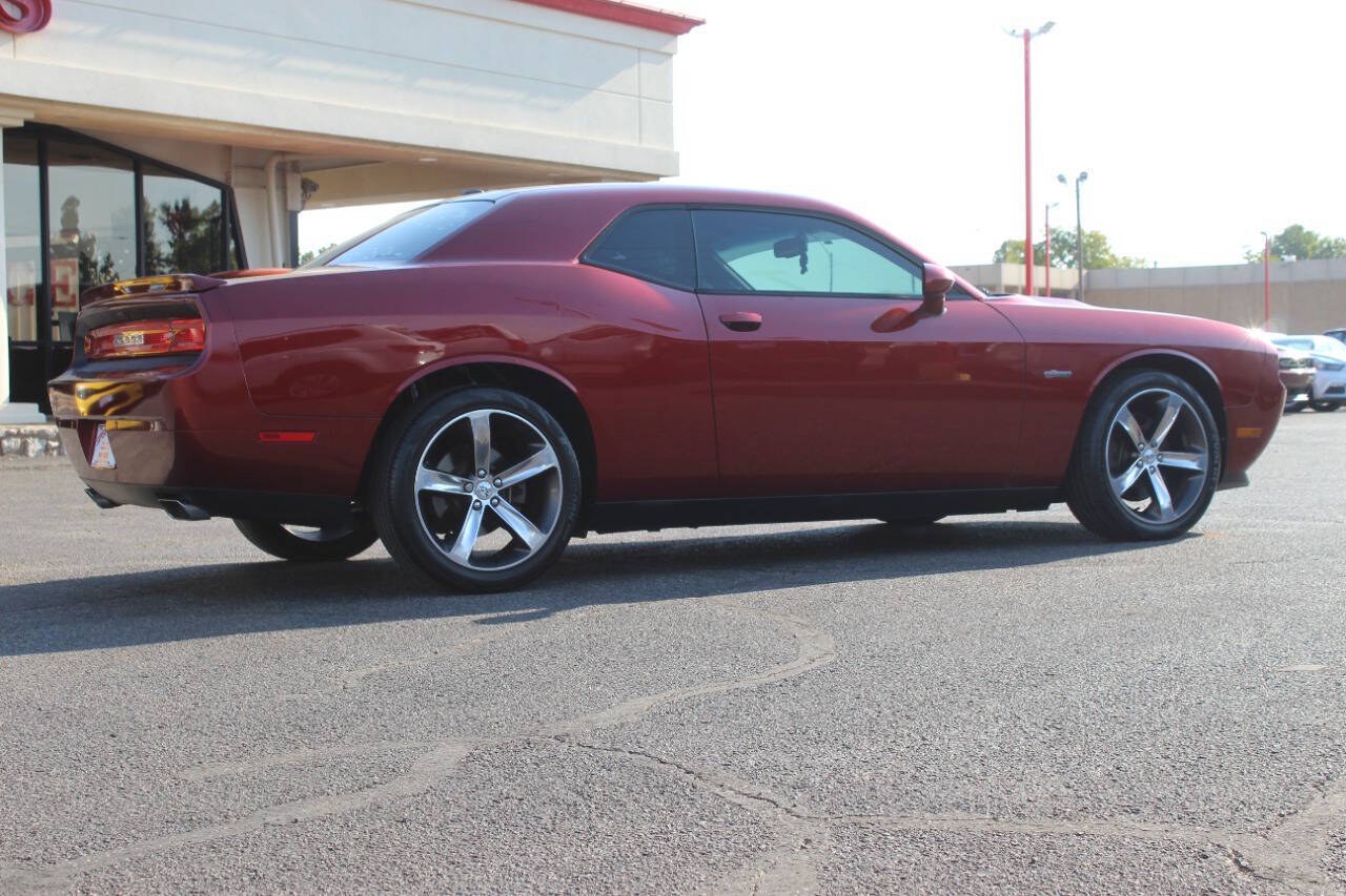 2014 Burgundy Dodge Challenger SXT (2C3CDYAG0EH) with an Pentastar 3.6L V6 305hp 268ft. lbs. 3.6L V6 engine, Automatic 5-Speed transmission, located at 4301 NW 39th , Oklahoma City, OK, 73112, (405) 949-5600, 35.512135, -97.598671 - Hablamos espanol. SPEND SMART --- BUY FROM SUPER SPORTS. ALL PRICES, DOWN PAYMENTS, PAYMENTS, AND FINANCE TERMS ARE NEGOTIABLE AT THE TIME OF APPROVAL. WE WILL WORK WITH YOU TO FIT YOUR BUDGET. WE WILL EVEN LOWER AND ADJUST THE NUMBERS TO HELP MAKE THE VEHICLE MORE AFFORDABLE FOR YOU.- Photo#1