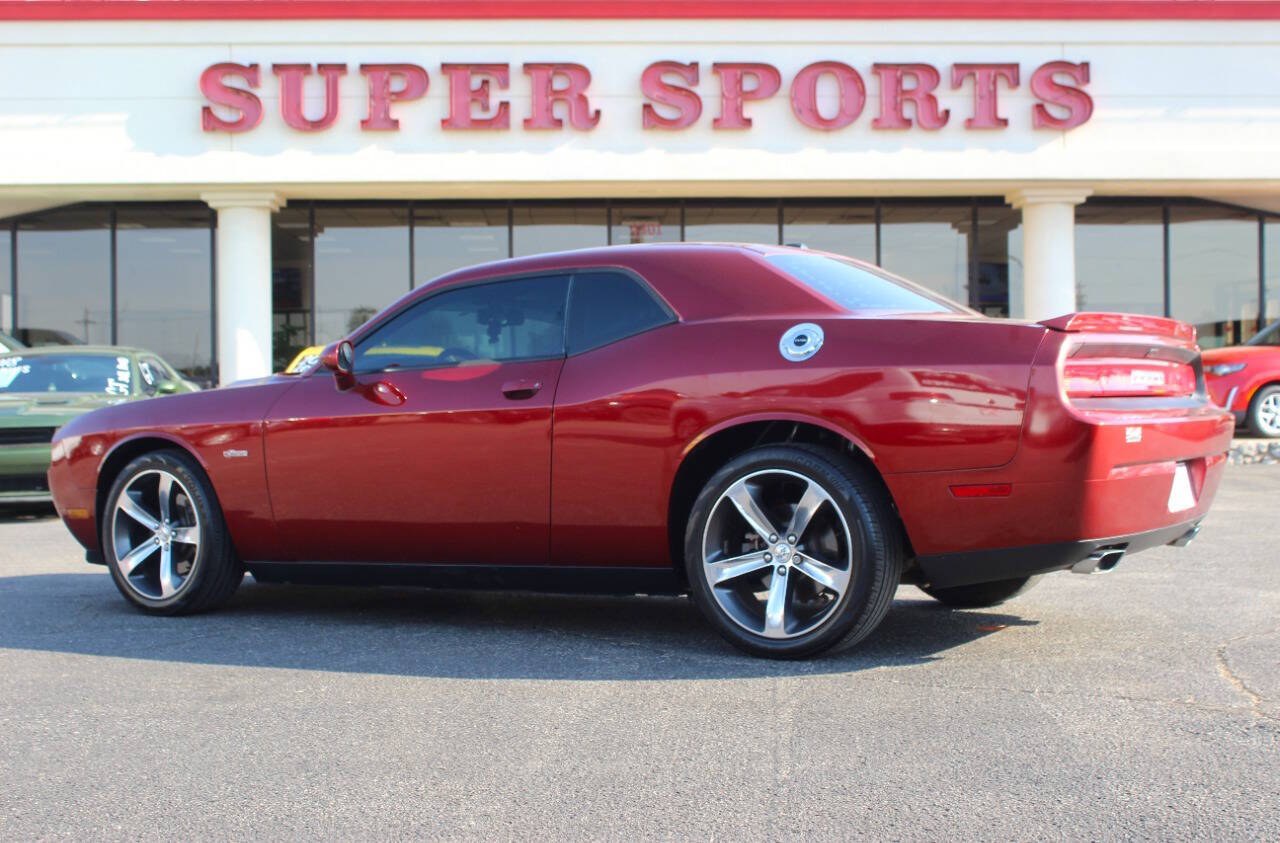 2014 Burgundy Dodge Challenger SXT (2C3CDYAG0EH) with an Pentastar 3.6L V6 305hp 268ft. lbs. 3.6L V6 engine, Automatic 5-Speed transmission, located at 4301 NW 39th , Oklahoma City, OK, 73112, (405) 949-5600, 35.512135, -97.598671 - Hablamos espanol. SPEND SMART --- BUY FROM SUPER SPORTS. ALL PRICES, DOWN PAYMENTS, PAYMENTS, AND FINANCE TERMS ARE NEGOTIABLE AT THE TIME OF APPROVAL. WE WILL WORK WITH YOU TO FIT YOUR BUDGET. WE WILL EVEN LOWER AND ADJUST THE NUMBERS TO HELP MAKE THE VEHICLE MORE AFFORDABLE FOR YOU.- Photo#3