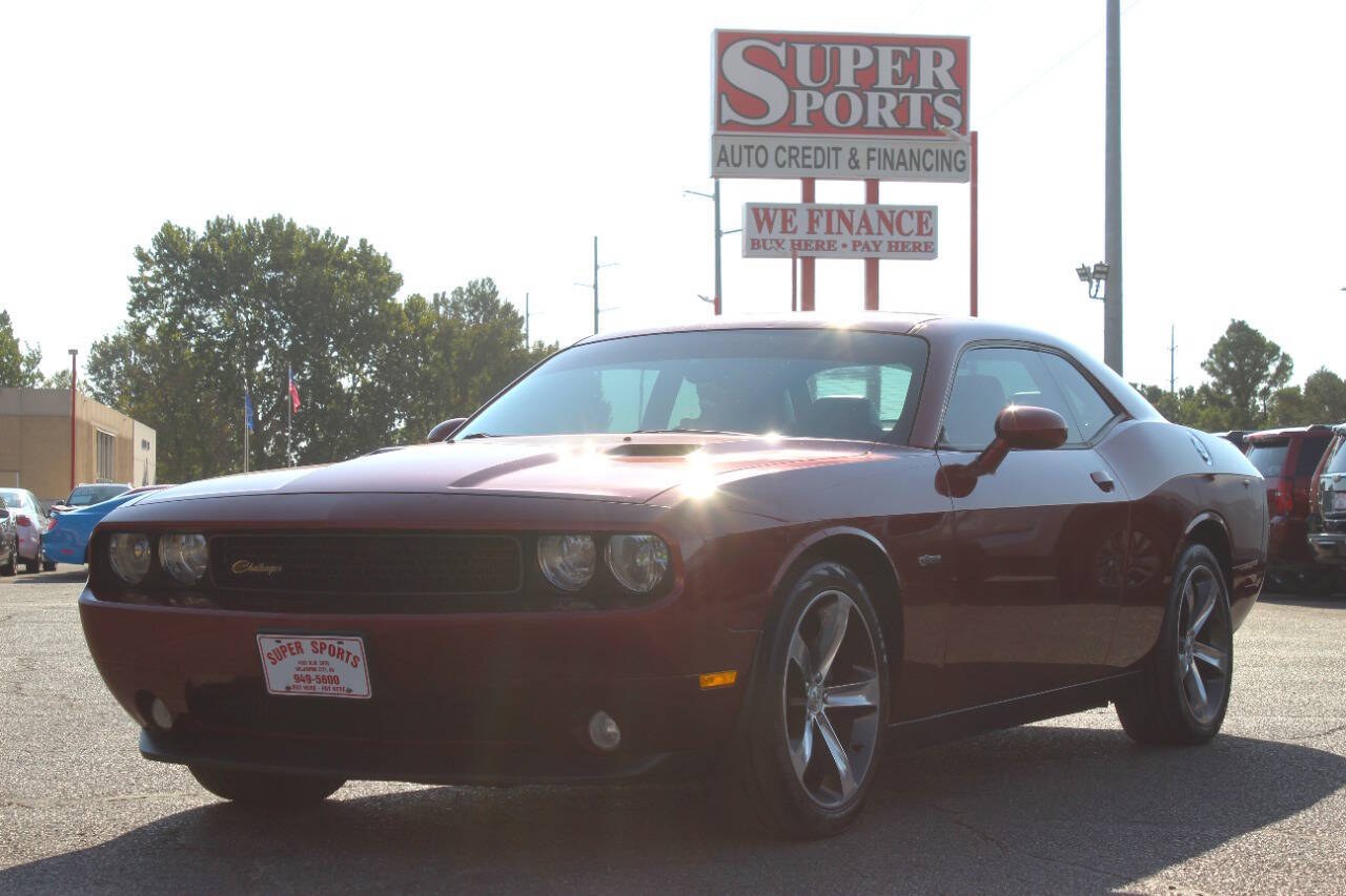 2014 Burgundy Dodge Challenger SXT (2C3CDYAG0EH) with an Pentastar 3.6L V6 305hp 268ft. lbs. 3.6L V6 engine, Automatic 5-Speed transmission, located at 4301 NW 39th , Oklahoma City, OK, 73112, (405) 949-5600, 35.512135, -97.598671 - Hablamos espanol. SPEND SMART --- BUY FROM SUPER SPORTS. ALL PRICES, DOWN PAYMENTS, PAYMENTS, AND FINANCE TERMS ARE NEGOTIABLE AT THE TIME OF APPROVAL. WE WILL WORK WITH YOU TO FIT YOUR BUDGET. WE WILL EVEN LOWER AND ADJUST THE NUMBERS TO HELP MAKE THE VEHICLE MORE AFFORDABLE FOR YOU.- Photo#5