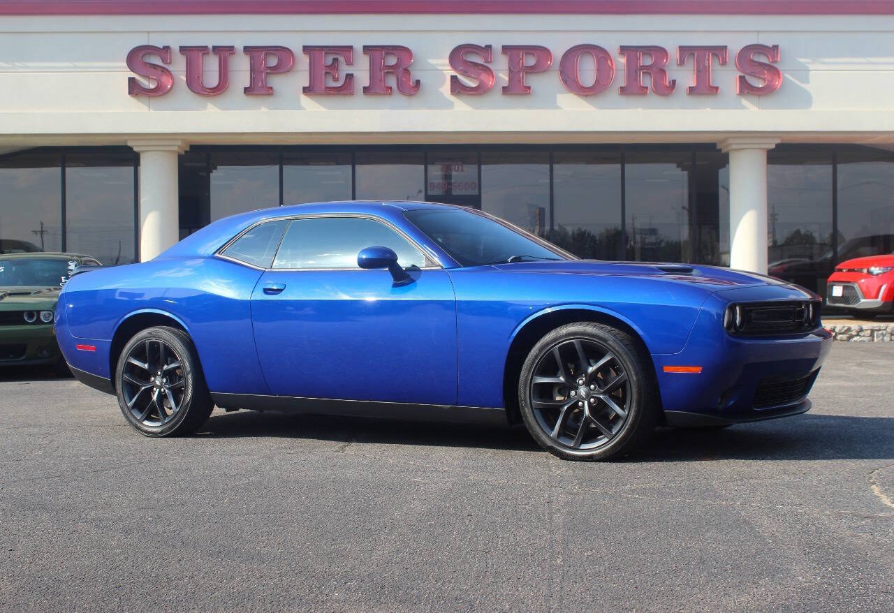 2022 Blue Dodge Challenger SXT (2C3CDZAG7NH) with an Pentastar 3.6L V6 303hp 268ft. lbs. 3.6L V6 engine, Automatic 8-Speed transmission, located at 4301 NW 39th , Oklahoma City, OK, 73112, (405) 949-5600, 35.512135, -97.598671 - Hablamos espanol. SPEND SMART --- BUY FROM SUPER SPORTS. ALL PRICES, DOWN PAYMENTS, PAYMENTS, AND FINANCE TERMS ARE NEGOTIABLE AT THE TIME OF APPROVAL. WE WILL WORK WITH YOU TO FIT YOUR BUDGET. WE WILL EVEN LOWER AND ADJUST THE NUMBERS TO HELP MAKE THE VE HICLE MORE AFFORDABLE FOR YOU.- Photo#0