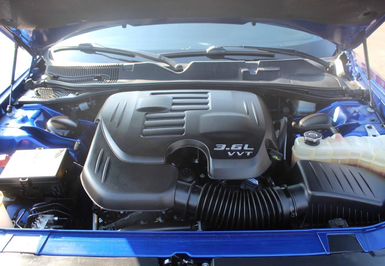 2022 Blue Dodge Challenger SXT (2C3CDZAG7NH) with an Pentastar 3.6L V6 303hp 268ft. lbs. 3.6L V6 engine, Automatic 8-Speed transmission, located at 4301 NW 39th , Oklahoma City, OK, 73112, (405) 949-5600, 35.512135, -97.598671 - Hablamos espanol. SPEND SMART --- BUY FROM SUPER SPORTS. ALL PRICES, DOWN PAYMENTS, PAYMENTS, AND FINANCE TERMS ARE NEGOTIABLE AT THE TIME OF APPROVAL. WE WILL WORK WITH YOU TO FIT YOUR BUDGET. WE WILL EVEN LOWER AND ADJUST THE NUMBERS TO HELP MAKE THE VE HICLE MORE AFFORDABLE FOR YOU.- Photo#6