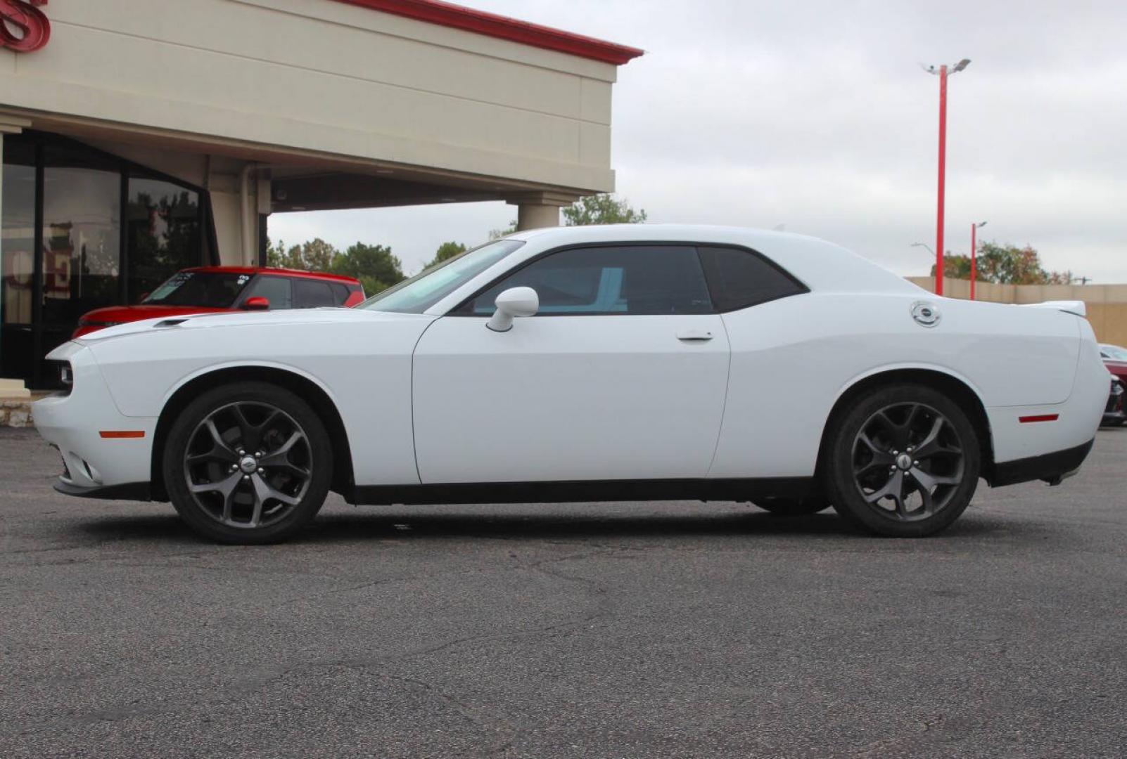 2018 White Dodge Challenger SXT (2C3CDZAG6JH) with an Pentastar 3.6L V6 305hp 268ft. lbs. 3.6L V6 engine, Automatic 8-Speed transmission, located at 4301 NW 39th , Oklahoma City, OK, 73112, (405) 949-5600, 35.512135, -97.598671 - Hablamos espanol. SPEND SMART --- BUY FROM SUPER SPORTS. ALL PRICES, DOWN PAYMENTS, PAYMENTS, AND FINANCE TERMS ARE NEGOTIABLE AT THE TIME OF APPROVAL. WE WILL WORK WITH YOU TO FIT YOUR BUDGET. WE WILL EVEN LOWER AND ADJUST THE NUMBERS TO HELP MAKE THE VE HICLE MORE AFFORDABLE FOR YOU.- Photo#5
