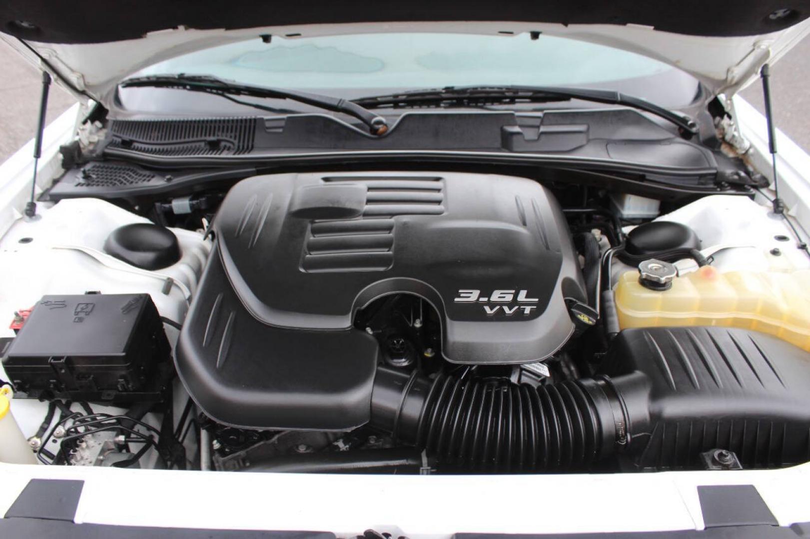 2018 White Dodge Challenger SXT (2C3CDZAG6JH) with an Pentastar 3.6L V6 305hp 268ft. lbs. 3.6L V6 engine, Automatic 8-Speed transmission, located at 4301 NW 39th , Oklahoma City, OK, 73112, (405) 949-5600, 35.512135, -97.598671 - Hablamos espanol. SPEND SMART --- BUY FROM SUPER SPORTS. ALL PRICES, DOWN PAYMENTS, PAYMENTS, AND FINANCE TERMS ARE NEGOTIABLE AT THE TIME OF APPROVAL. WE WILL WORK WITH YOU TO FIT YOUR BUDGET. WE WILL EVEN LOWER AND ADJUST THE NUMBERS TO HELP MAKE THE VE HICLE MORE AFFORDABLE FOR YOU.- Photo#7
