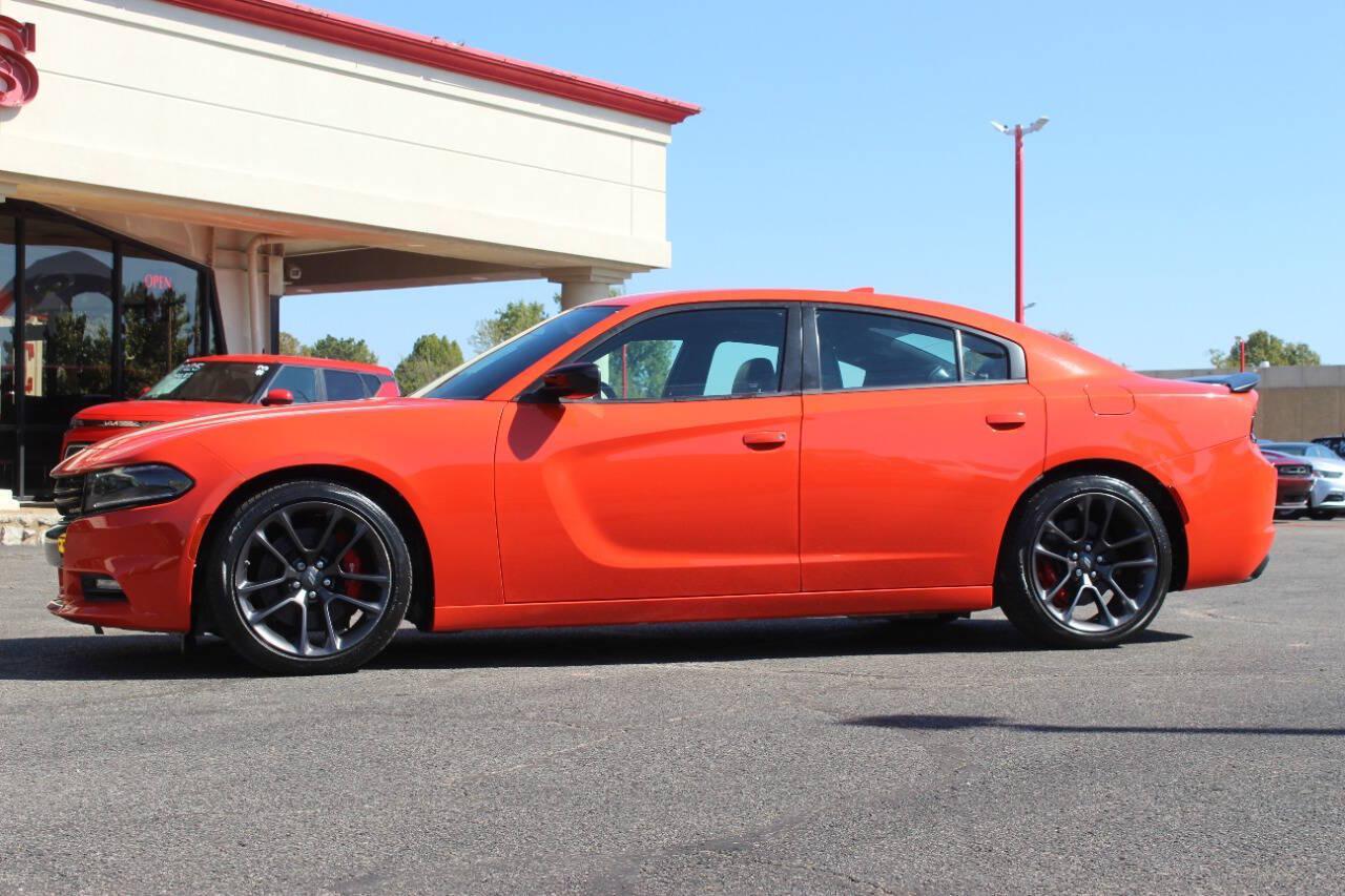 2023 Orange Dodge Charger SXT (2C3CDXBG2PH) with an Pentastar 3.6L V6 292hp 260ft. lbs. 3.6L V6 engine, Automatic 8-Speed transmission, located at 4301 NW 39th , Oklahoma City, OK, 73112, (405) 949-5600, 35.512135, -97.598671 - Hablamos espanol. SPEND SMART --- BUY FROM SUPER SPORTS. ALL PRICES, DOWN PAYMENTS, PAYMENTS, AND FINANCE TERMS ARE NEGOTIABLE AT THE TIME OF APPROVAL. WE WILL WORK WITH YOU TO FIT YOUR BUDGET. WE WILL EVEN LOWER AND ADJUST THE NUMBERS TO HELP MAKE THE VE HICLE MORE AFFORDABLE FOR YOU.- Photo#5