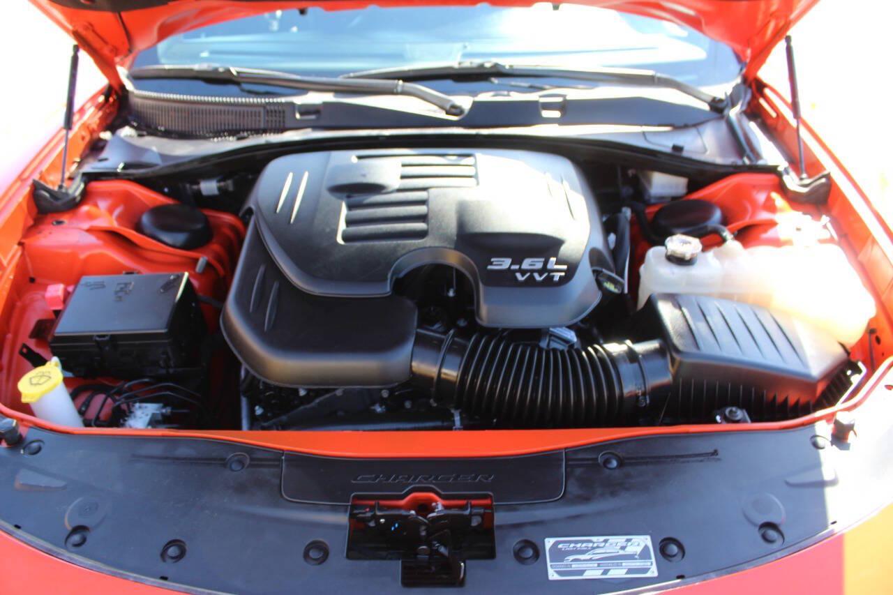 2023 Orange Dodge Charger SXT (2C3CDXBG2PH) with an Pentastar 3.6L V6 292hp 260ft. lbs. 3.6L V6 engine, Automatic 8-Speed transmission, located at 4301 NW 39th , Oklahoma City, OK, 73112, (405) 949-5600, 35.512135, -97.598671 - Hablamos espanol. SPEND SMART --- BUY FROM SUPER SPORTS. ALL PRICES, DOWN PAYMENTS, PAYMENTS, AND FINANCE TERMS ARE NEGOTIABLE AT THE TIME OF APPROVAL. WE WILL WORK WITH YOU TO FIT YOUR BUDGET. WE WILL EVEN LOWER AND ADJUST THE NUMBERS TO HELP MAKE THE VE HICLE MORE AFFORDABLE FOR YOU.- Photo#7