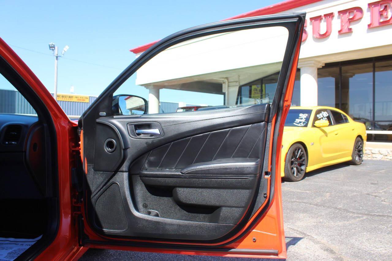 2023 Orange Dodge Charger SXT (2C3CDXBG2PH) with an Pentastar 3.6L V6 292hp 260ft. lbs. 3.6L V6 engine, Automatic 8-Speed transmission, located at 4301 NW 39th , Oklahoma City, OK, 73112, (405) 949-5600, 35.512135, -97.598671 - Hablamos espanol. SPEND SMART --- BUY FROM SUPER SPORTS. ALL PRICES, DOWN PAYMENTS, PAYMENTS, AND FINANCE TERMS ARE NEGOTIABLE AT THE TIME OF APPROVAL. WE WILL WORK WITH YOU TO FIT YOUR BUDGET. WE WILL EVEN LOWER AND ADJUST THE NUMBERS TO HELP MAKE THE VE HICLE MORE AFFORDABLE FOR YOU.- Photo#8